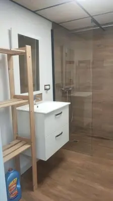 a bathroom with a white sink and a shower at Playa Puebla de Farnals Valencia in Masalfasar