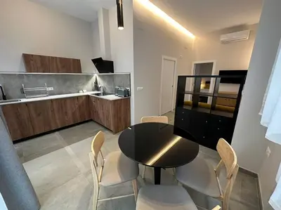 a kitchen with a table and chairs in a room at Industrial Style Ruzafa in Valencia